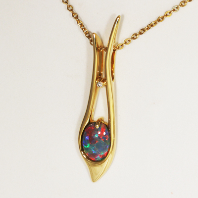 18k Yellow Gold Pendant with a SOLID BLACK OPAL Beautiful fiery red blue, Floral Harlequin pattern, top quality.